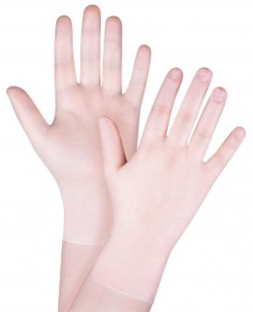 A pair of vinyl gloves lying on a white surface, providing a barrier against potential hazards in various industries.