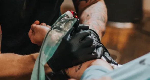Tattoo Artist with Nitrile Gloves
