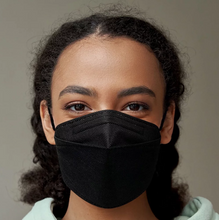 Load image into Gallery viewer, A black CA -  N95 mask with ear loops and a metal nose strip, on a women face
